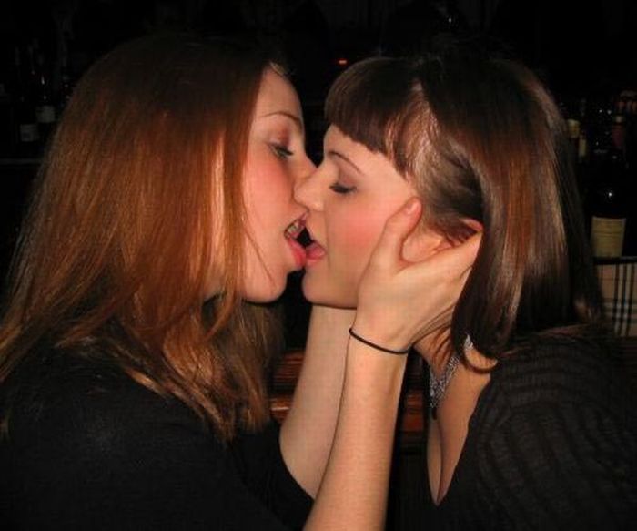 Twins lick each other