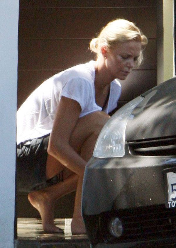 Charlize Theron washing her car (6 pics)