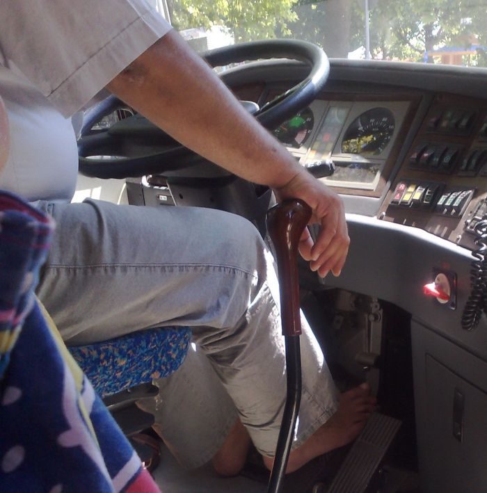 Bulgarian bus driver airing his shoes (2 pics)