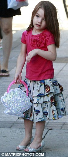 Suri, the daughter of Tom Cruise and Katie Holmes wears high heels (13 pics)