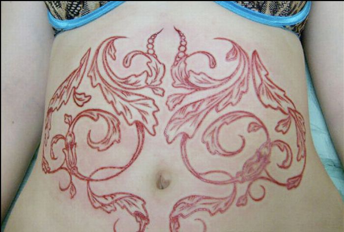 Insane Scarification Tattoos (25 pics)