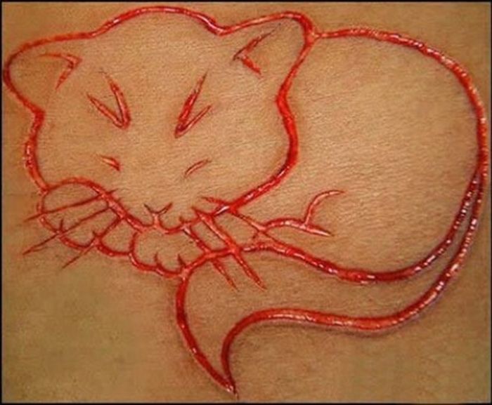 Insane Scarification Tattoos (25 pics)