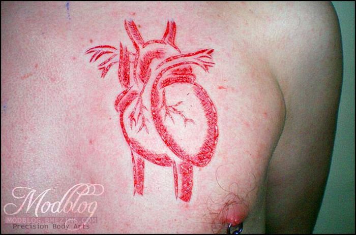 Insane Scarification Tattoos (25 pics)