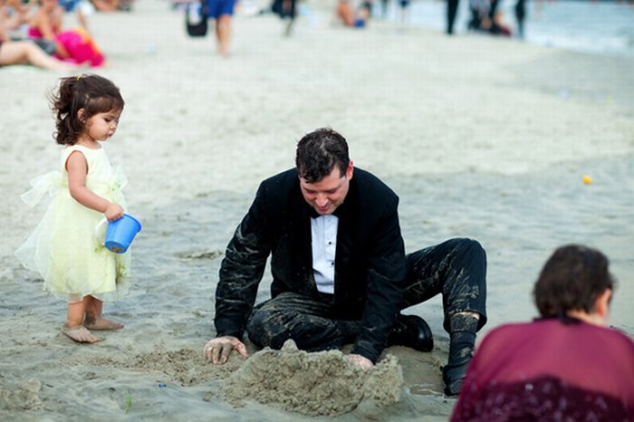 People in Black on a Beach (9 pics)