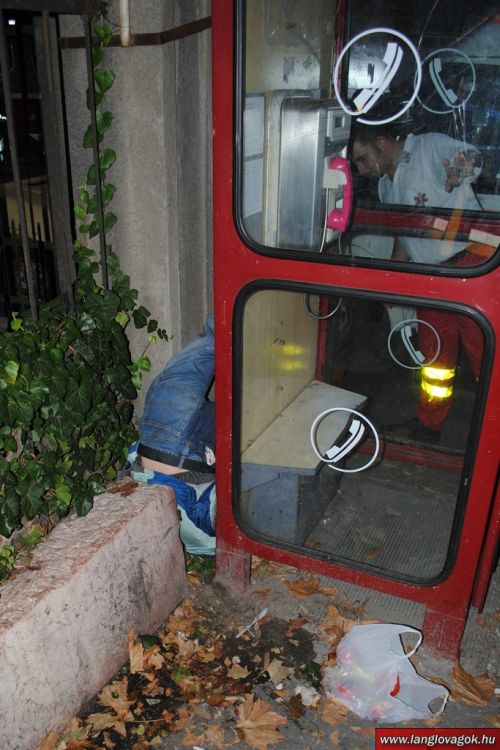 Drunk Man Trapped Upside Down Behind a Booth (11 pics)