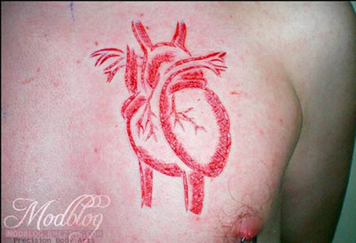 Extreme Scarification Tattoos (17 pics)