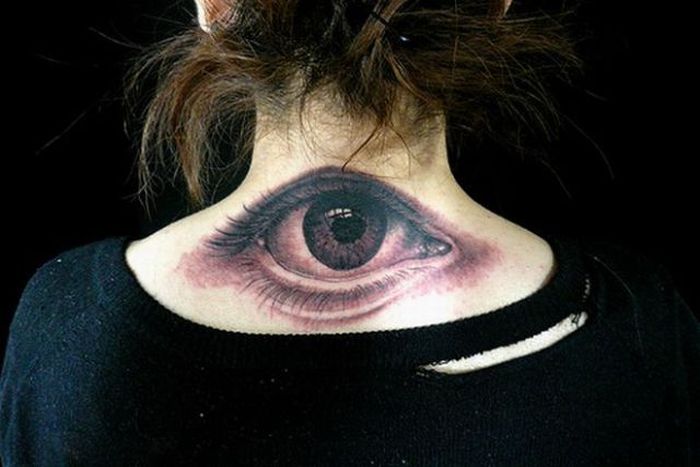 flying eyeball tattoo