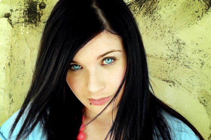 1. "Dark-haired woman with piercing blue eyes" - wide 6