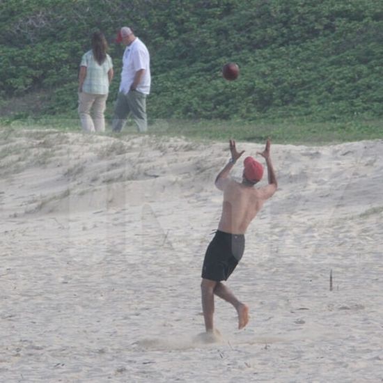 President Obama Plays Football in Hawaii (15 pics)