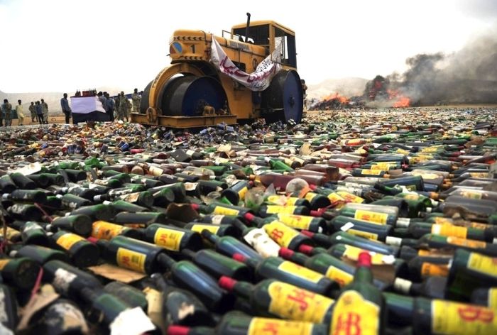 Liquor Bottles Smashed By A Steamroller (9 pics)