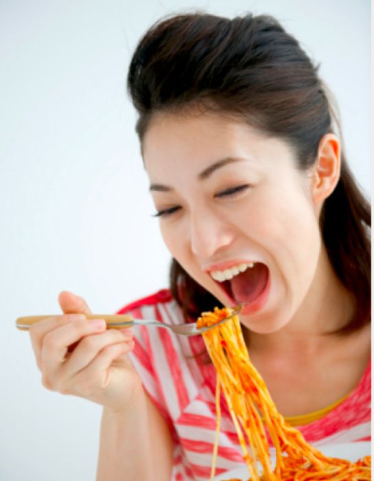 Women Eating Pasta Stock Photos (25 pics)