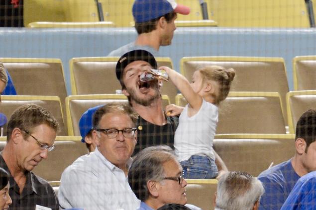 David Beckham and His 1-Year-Old Daughter at Dodgers Game (7 pics)