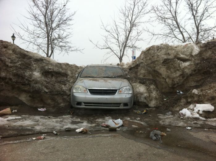 Car Frozen In Snowbank (3 pics)