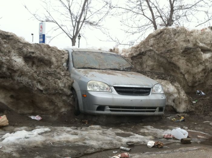 Car Frozen In Snowbank (3 pics)