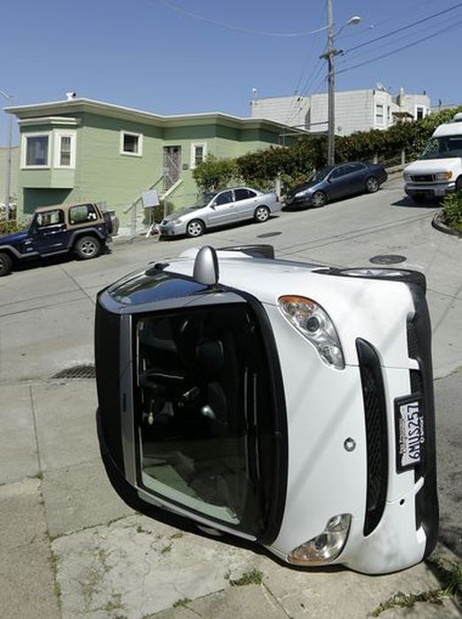 Bad Guys Flipping Over Smart Cars In San Francisco (8 pics)