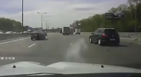 Spinning Wheel Crashes Into A Car On The Highway