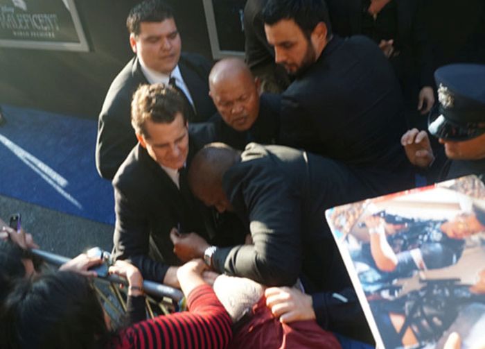 Brad Pitt Gets Hit In The Face At Maleficent Premiere (9 pics)