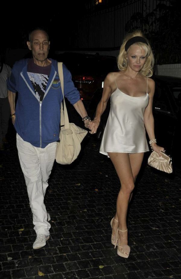 Pamela Anderson Has A Wardrobe Malfunction (12 pics)