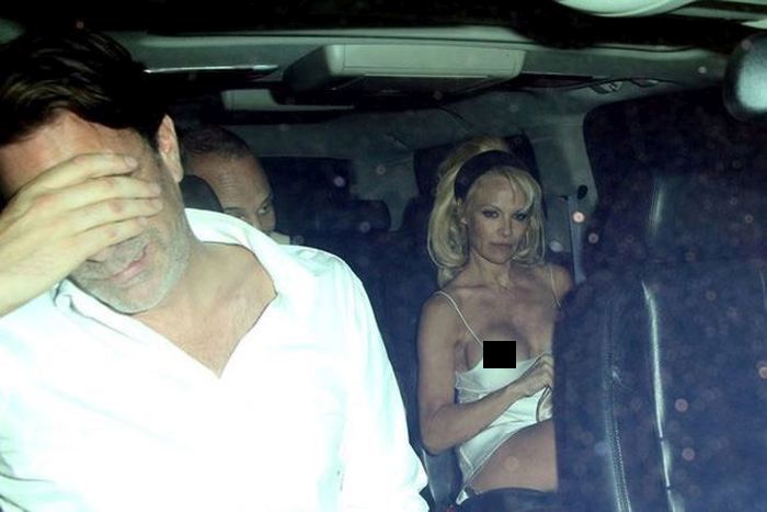 Pamela Anderson Has A Wardrobe Malfunction (12 pics)