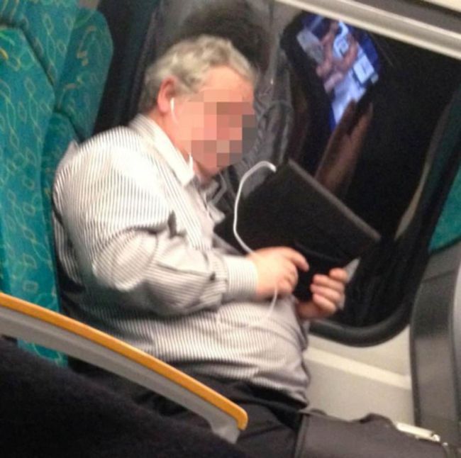 No One Noticed What This Guy Was Watching On The Train (2 pics)