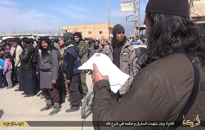 ISIS Amputates Hand Of A Motorbike Thief (8 pics)