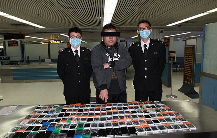 Smuggler Gets Busted With 146 iPhones Taped To His Body (3 pics)