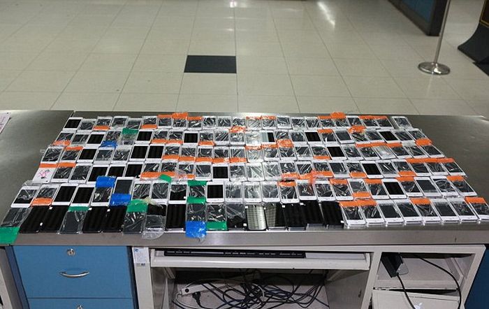 Smuggler Gets Busted With 146 iPhones Taped To His Body (3 pics)