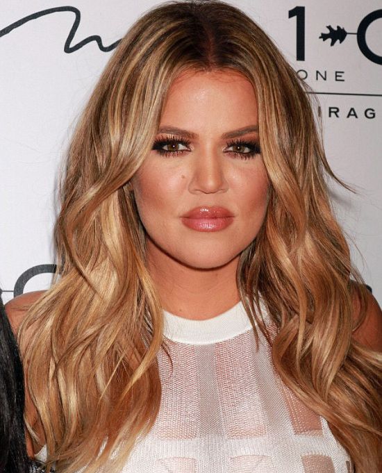 Khloe Kardashian Shows Off Her Body In A Tight White Dress (16 pics)