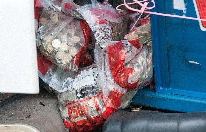 Millions Of Coins Spill On To The Streets Of England (16 pics)