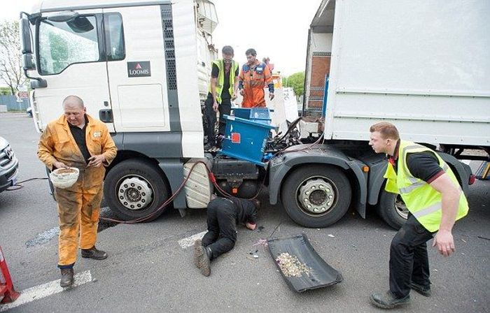 Millions Of Coins Spill On To The Streets Of England (16 pics)