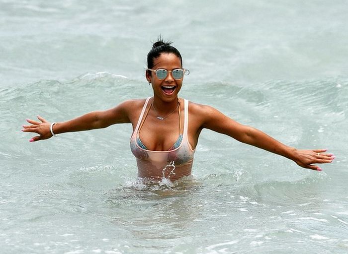 Christina Milian Hangs Out On The Beach In A Soaking Wet Bikini (5 pics)
