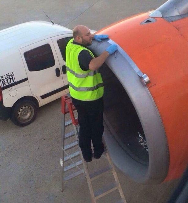Airport Worker Tapes Up A Plane Minutes Before Takeoff