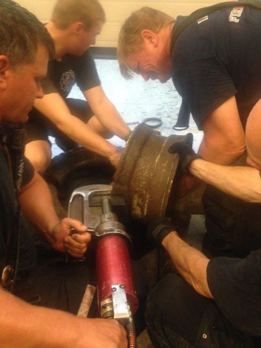 Firefighters Rescue Dog That Got Its Head Stuck In A Wheel (20 pics)