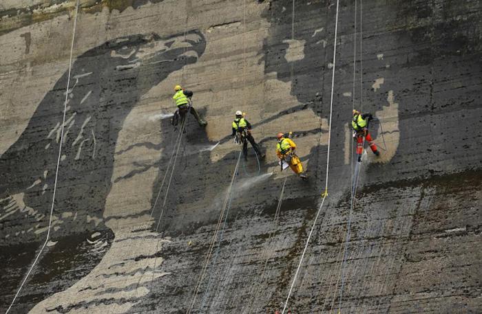 Workers Used Pressure Washers To Create This Stunning Mural On A Polish Dam (6 pics)