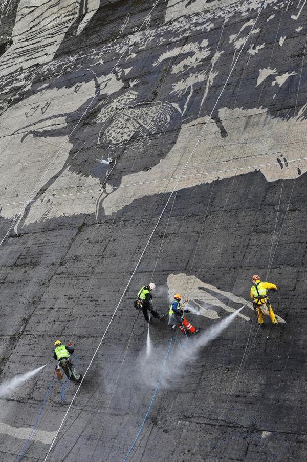 Workers Used Pressure Washers To Create This Stunning Mural On A Polish Dam (6 pics)