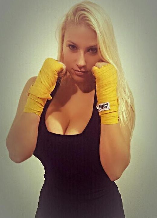 MMA Fighter's Breasts Get Her Bumped Up To A Heavier Weight Class (5 pics)