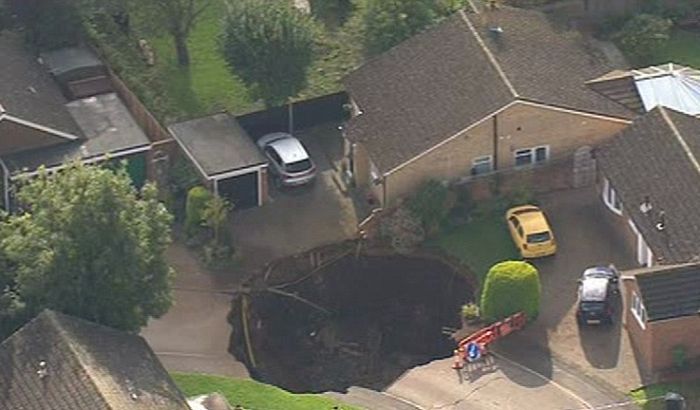 Enormous Sinkhole Swallows A Section Of The Street (3 pics)
