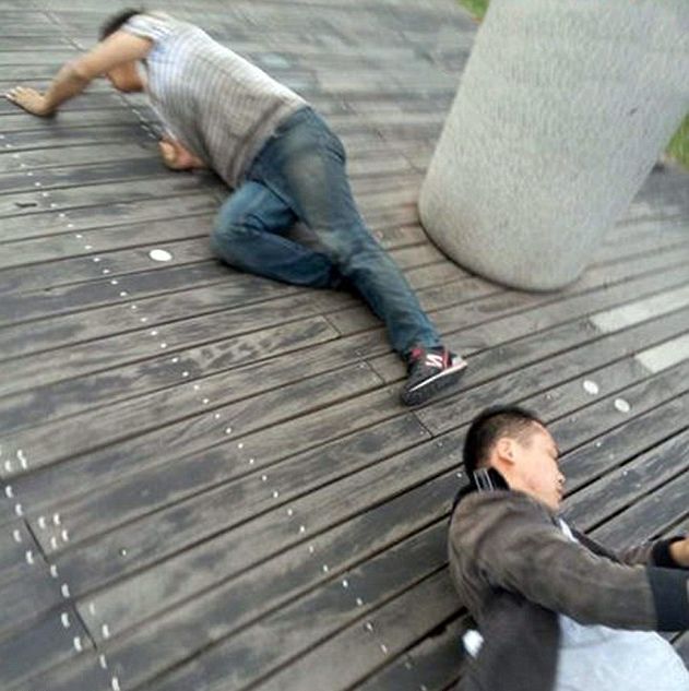 Chinese Company Forces Staff To Crawl When They Don't Meet Sales Goals (5 pics)