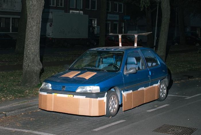 One Man Is Pimping Out People's Cars With Cardboard (8 pics)