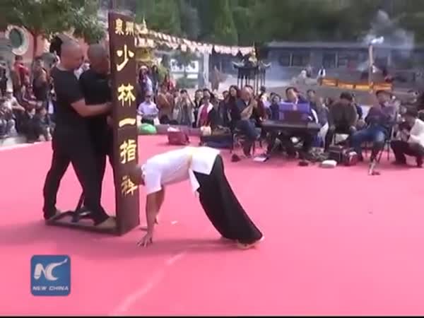 Shaolin Monk Balances On 2 Fingers