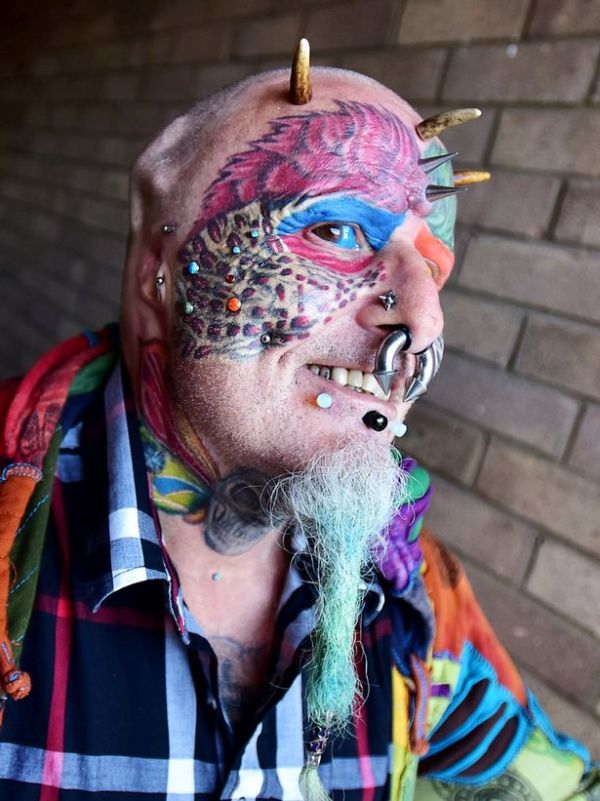 Animal Lover Chops Off His Ears So He Can Look Like A Parrot (8 pics)