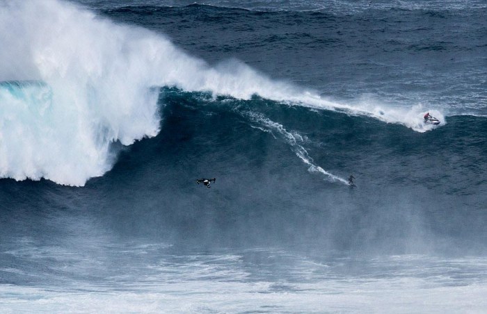 People Watch In Awe As Surfers Ride 100 Foot Waves (7 pics)