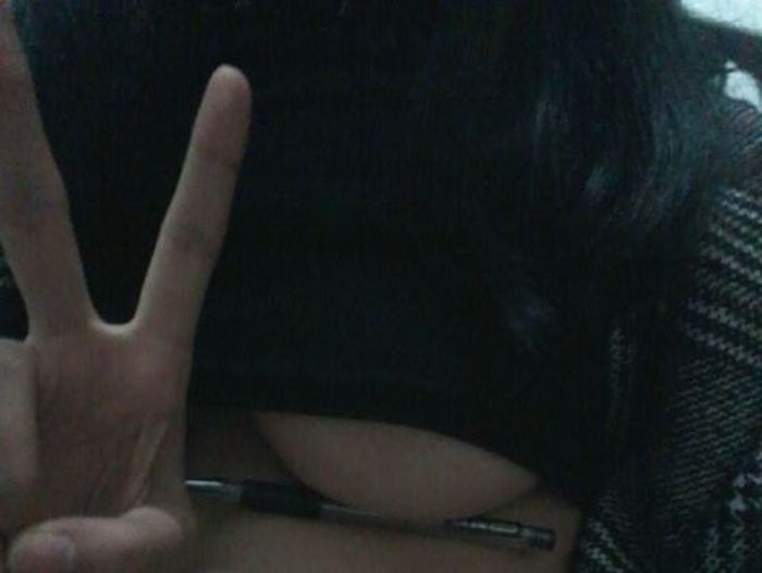 Women Trying To Hold Pens Under Their Breasts (15 pics)