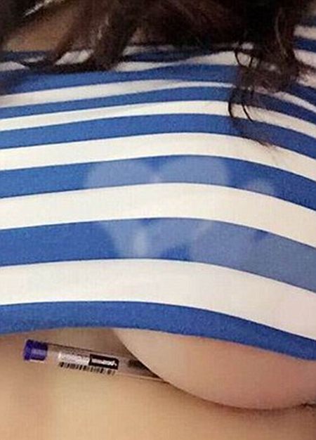 Women Trying To Hold Pens Under Their Breasts (15 pics)