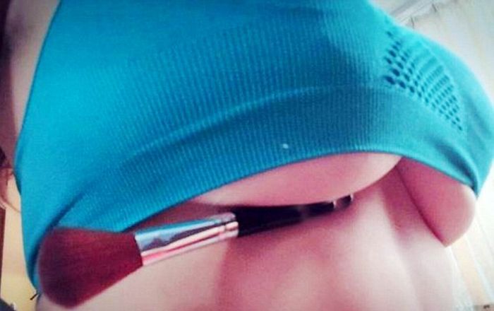 Women Trying To Hold Pens Under Their Breasts (15 pics)