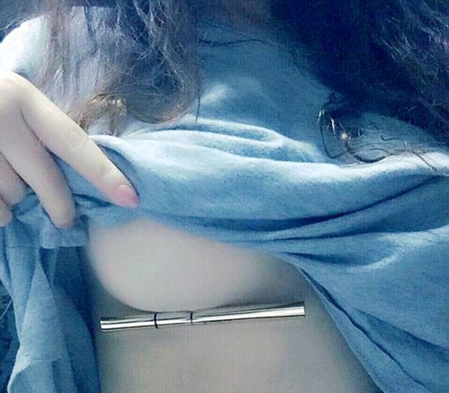 Women Trying To Hold Pens Under Their Breasts (15 pics)