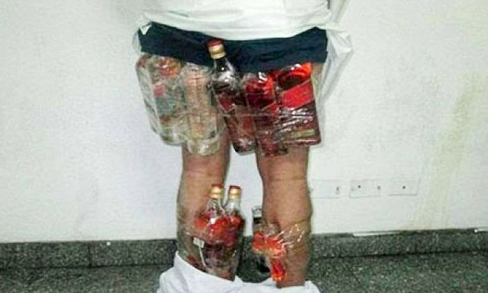 Saudi Man Gets Busted While Trying To Smuggle Booze In His Pants (4 pics)