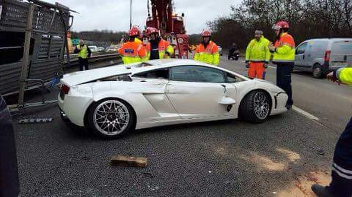 Transporter Carrying 9 Supercars Overturns On The Road (9 pics)