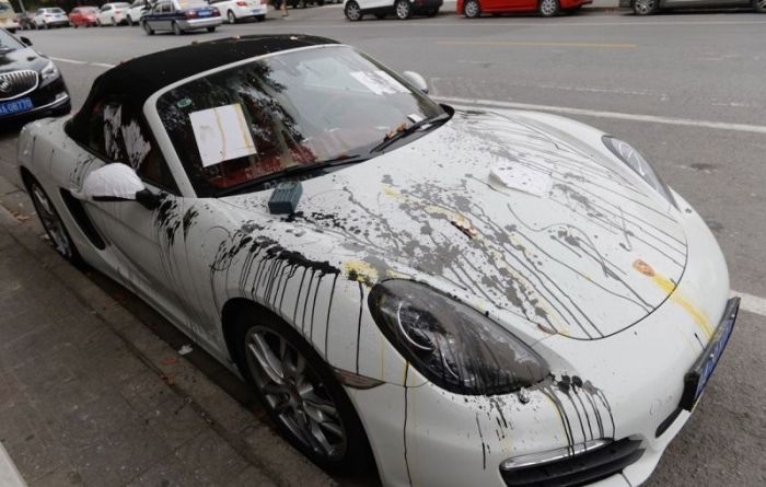 Porsche Gets Trashed When Locals Find It In The Wrong Spot (5 pics)