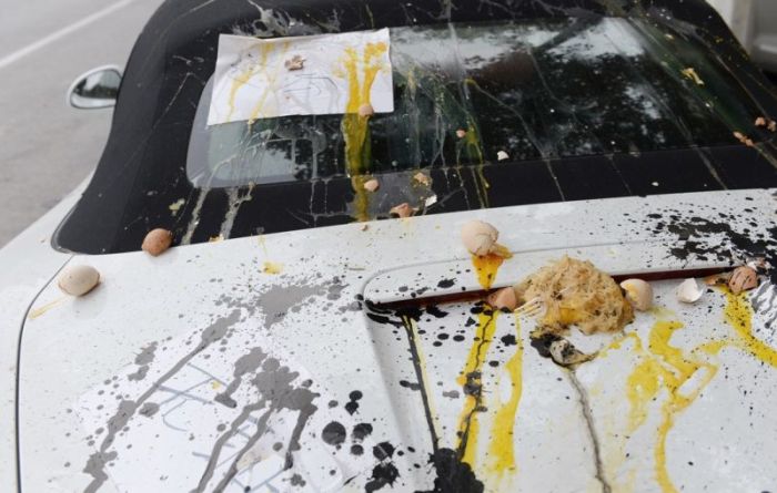 Porsche Gets Trashed When Locals Find It In The Wrong Spot (5 pics)